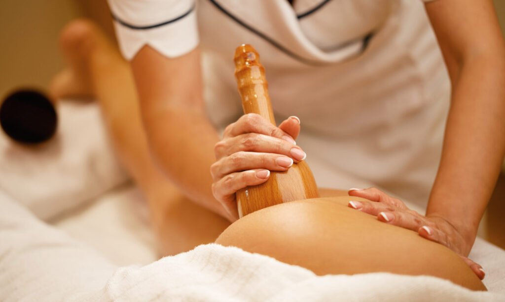 Close-up of woman having anti cellulite massage during maderotherapy treatment at the spa.